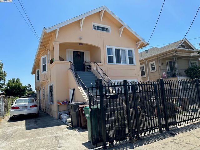 a front view of a house with parking