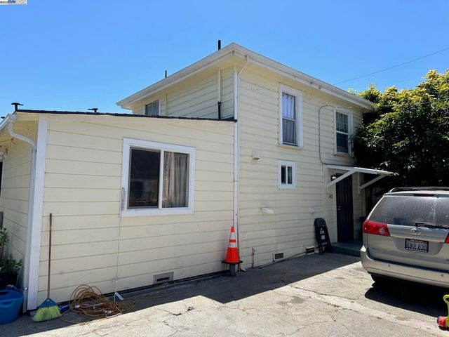 a front view of a house with parking space