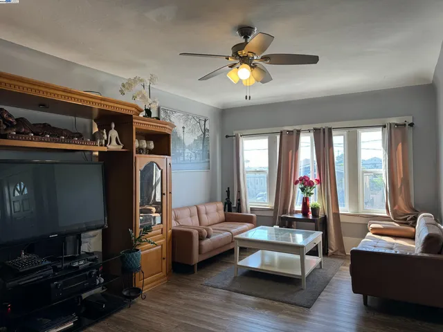 a bedroom with furniture and a chandelier