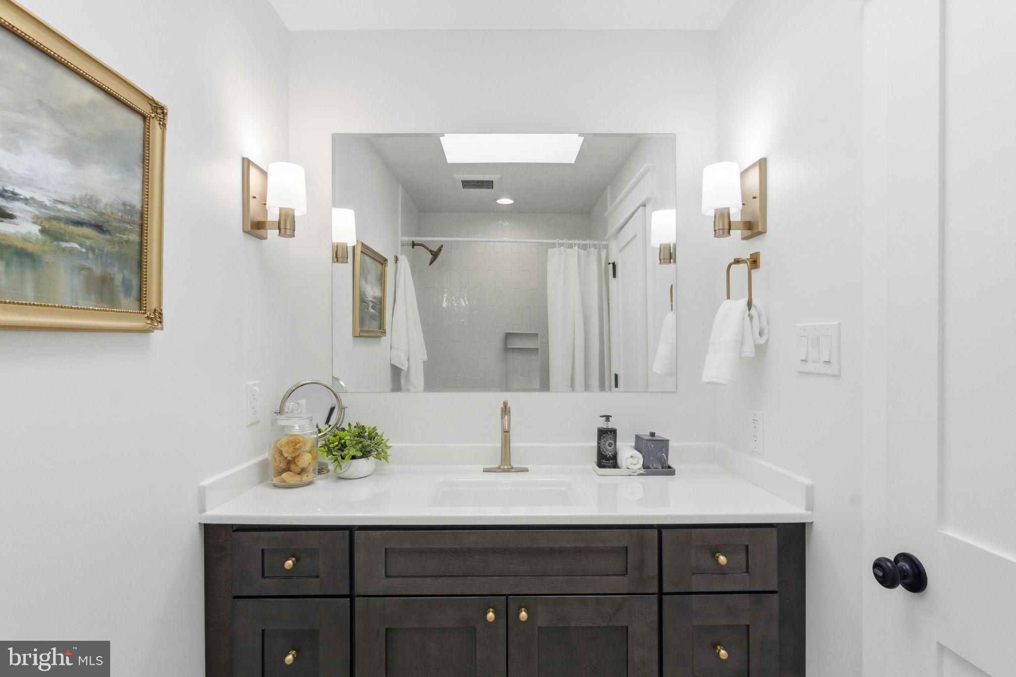 8615 Kerry Lane Springfield, VA 22152 - Photo 25 of 50 a bathroom with a sink double vanity and mirror
