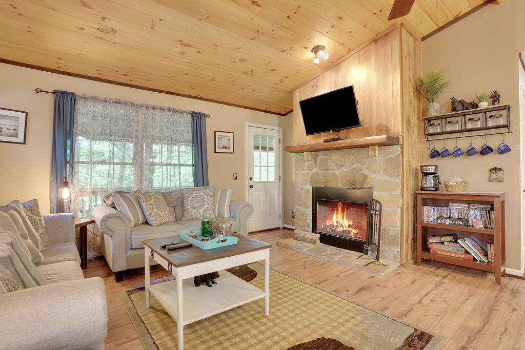 41 Courtside Court Ellijay, GA 30540 - Photo 1 of 34 a living room with furniture a flat screen tv and a fireplace