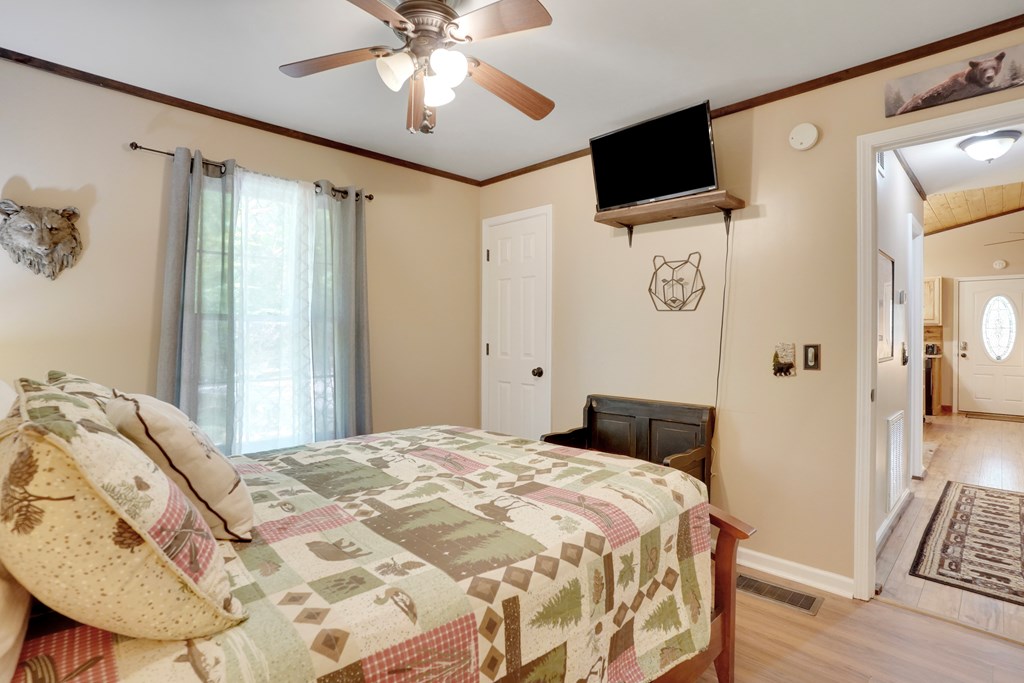 41 Courtside Court Ellijay, GA 30540 - Photo 13 of 34 a bedroom with a bed and a flat screen tv