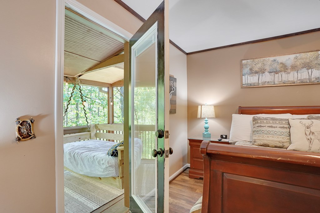 41 Courtside Court Ellijay, GA 30540 - Photo 16 of 34 a bedroom with a bed and a window