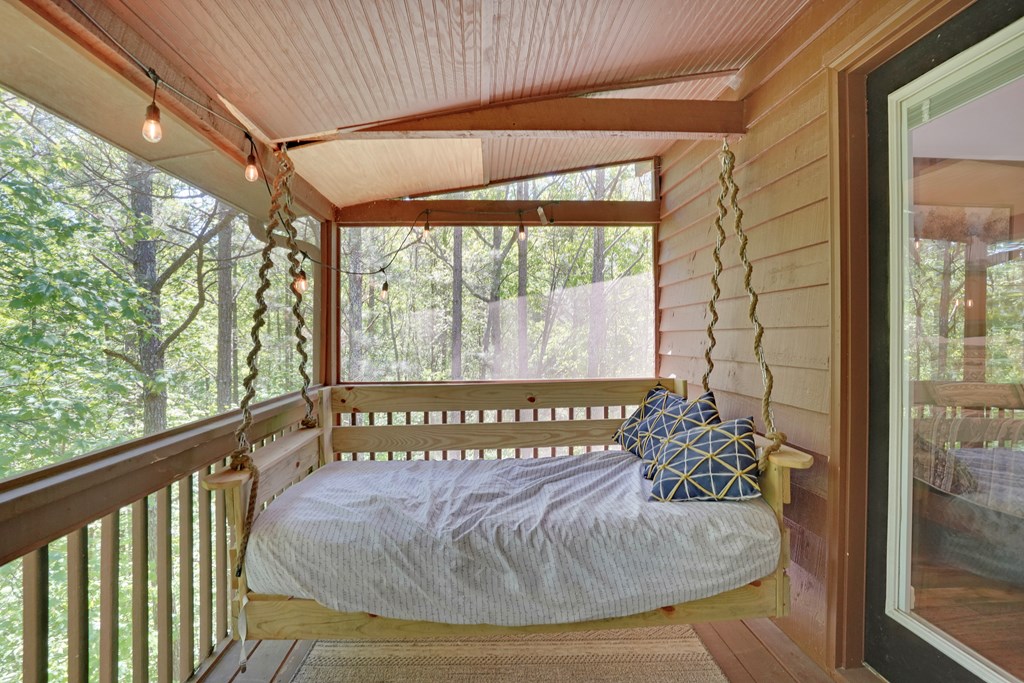 41 Courtside Court Ellijay, GA 30540 - Photo 17 of 34 a view of a porch with a table and chair