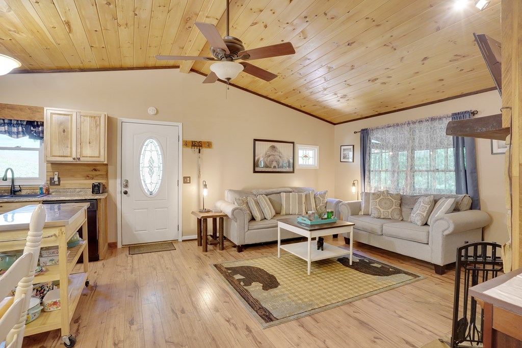 41 Courtside Court Ellijay, GA 30540 - Photo 25 of 34 a living room with furniture and a wooden floor