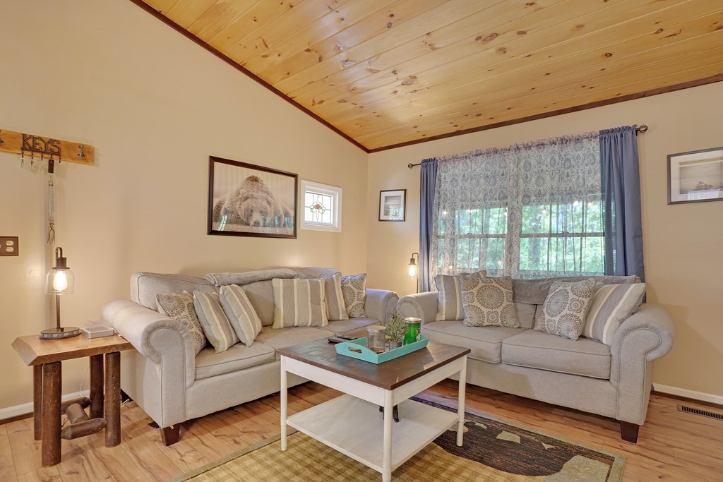41 Courtside Court Ellijay, GA 30540 - Photo 7 of 34 a living room with furniture and a large window
