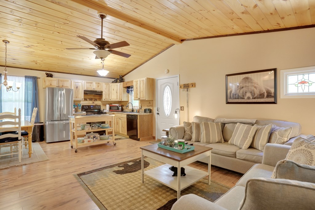 41 Courtside Court Ellijay, GA 30540 - Photo 9 of 34 a living room with furniture kitchen view and a chandelier