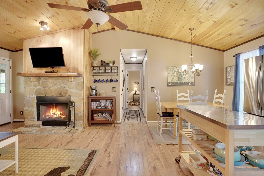 41 Courtside Court Ellijay, GA 30540 - Photo 10 of 34 a living room with furniture a flat screen tv and a fireplace
