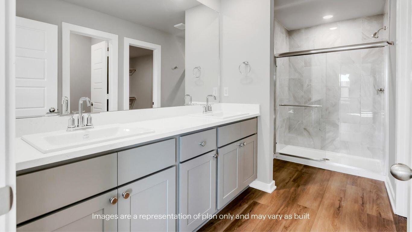 224 18th Street Wolfforth, TX 79382 - Photo 14 of 27 a bathroom with a sink and a mirror