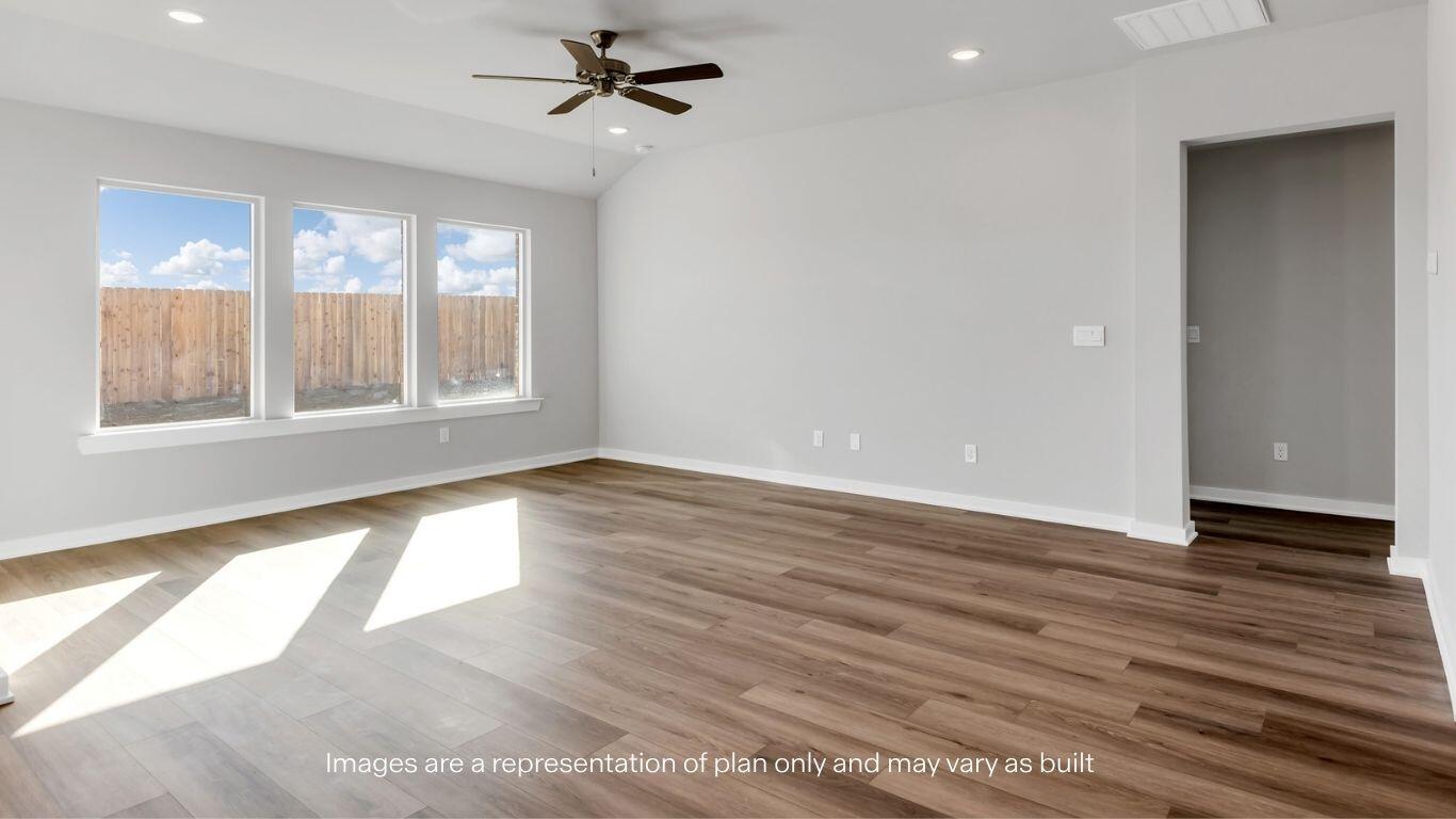 224 18th Street Wolfforth, TX 79382 - Photo 5 of 27 an empty room with wooden floor and windows