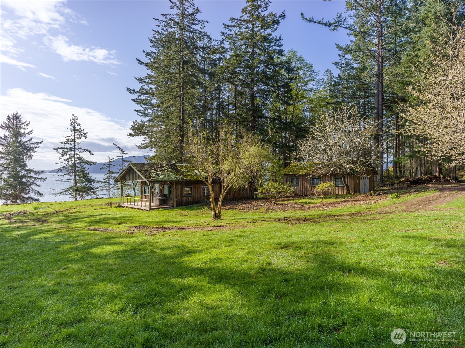 557 Old Sentinel Road Orcas Island, WA 98279 - Photo 24 of 40 a view of a big yard with a house and large trees