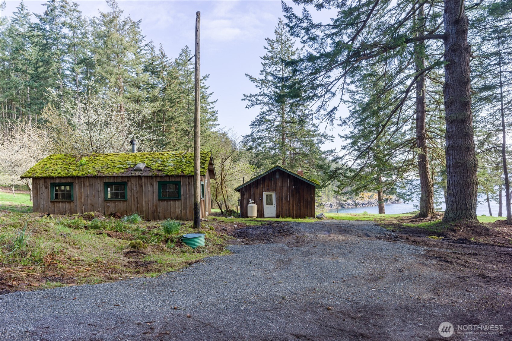 557 Old Sentinel Road Orcas Island, WA 98279 - Photo 34 of 40 a front view of house with yard and trees