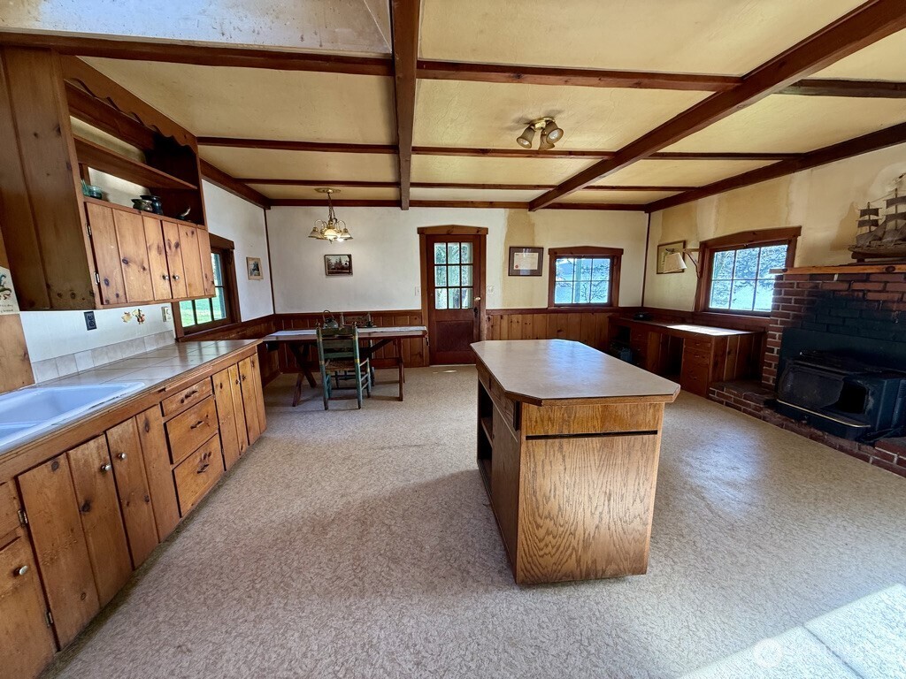 557 Old Sentinel Road Orcas Island, WA 98279 - Photo 36 of 40 a living room with stainless steel appliances granite countertop lots of counter top space