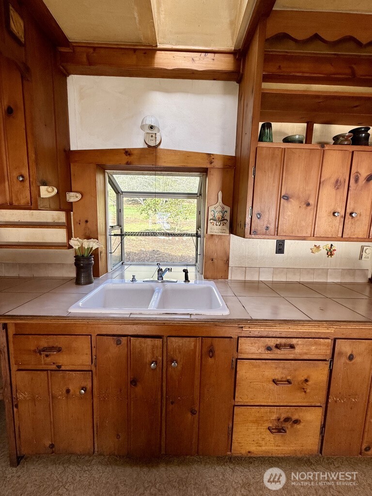 557 Old Sentinel Road Orcas Island, WA 98279 - Photo 38 of 40 a kitchen with cabinets and window