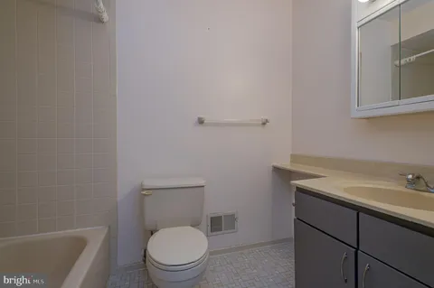 a bathroom with a sink a toilet and a bathtub
