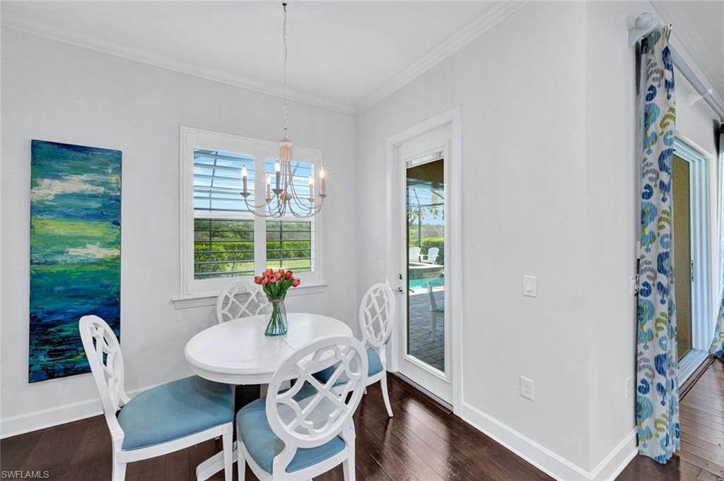 9311 Fieldstone Lane Naples, FL 34120 - Photo 12 of 48 a view of a dining room with furniture window and wooden floor