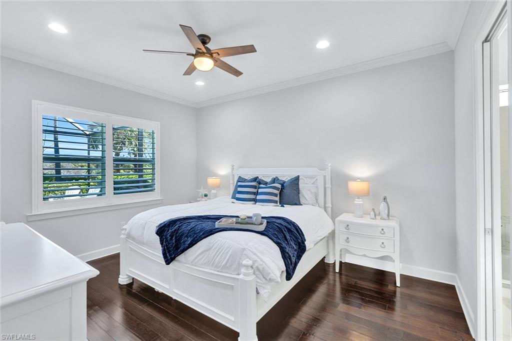 9311 Fieldstone Lane Naples, FL 34120 - Photo 18 of 48 a bedroom with a large bed and a window
