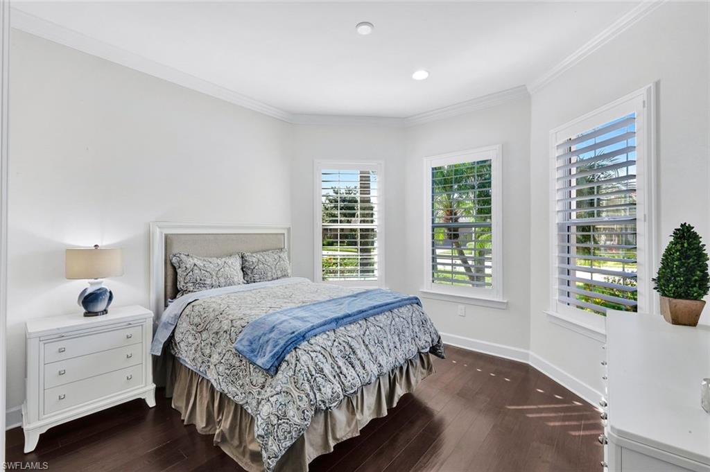 9311 Fieldstone Lane Naples, FL 34120 - Photo 22 of 48 a bedroom with a bed and a window