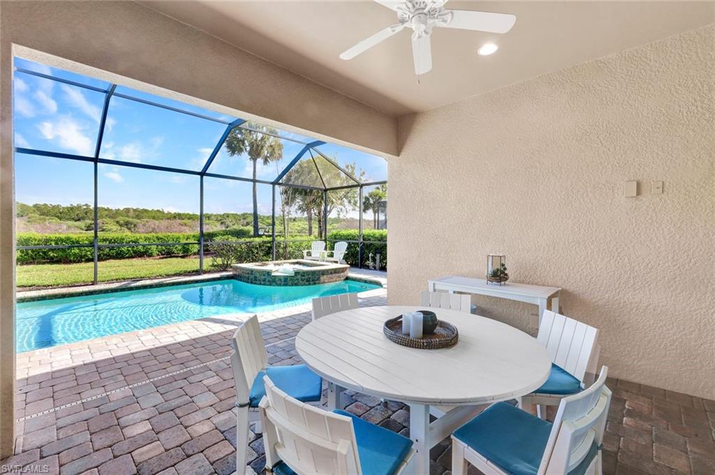 9311 Fieldstone Lane Naples, FL 34120 - Photo 25 of 48 a view of a dining room with furniture window and outside view