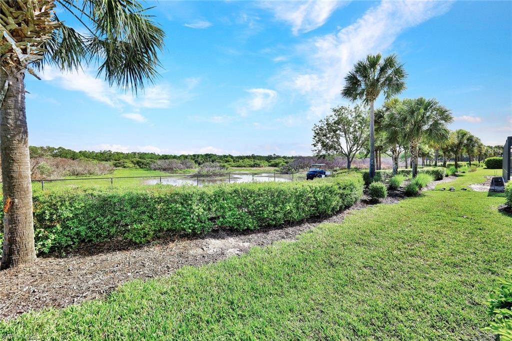 9311 Fieldstone Lane Naples, FL 34120 - Photo 31 of 48 a view of a lake with a big yard