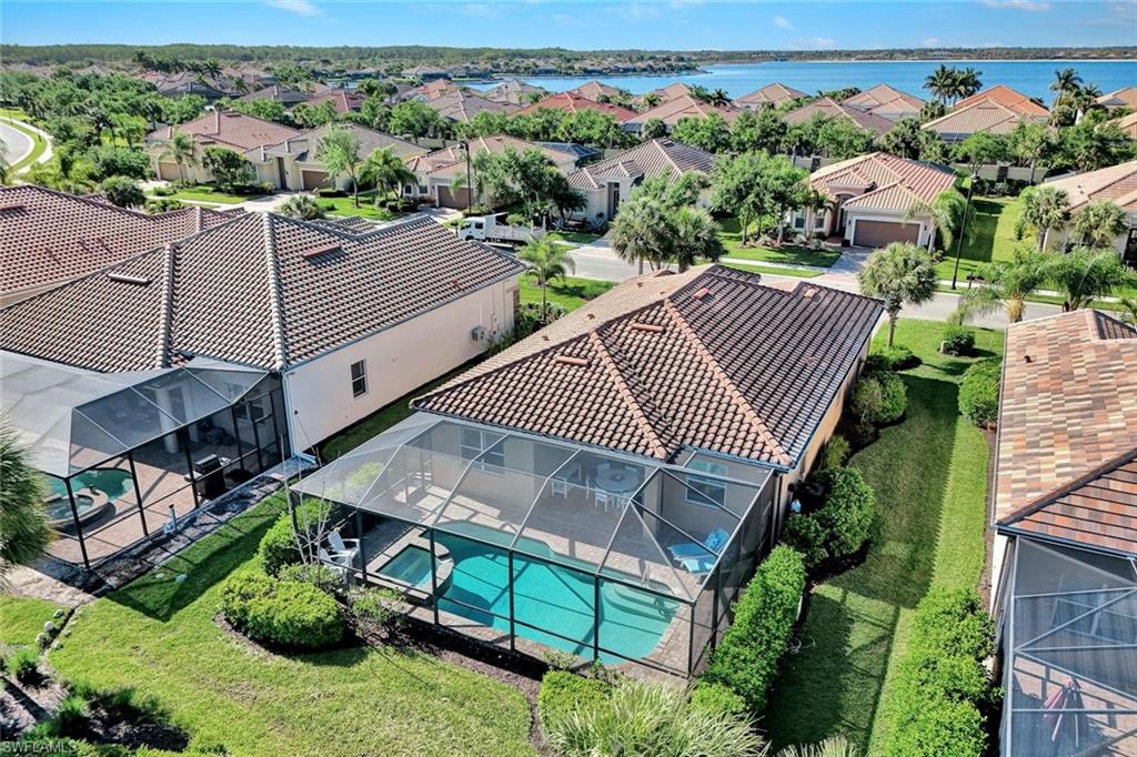 9311 Fieldstone Lane Naples, FL 34120 - Photo 35 of 48 an aerial view of multiple houses with a yard