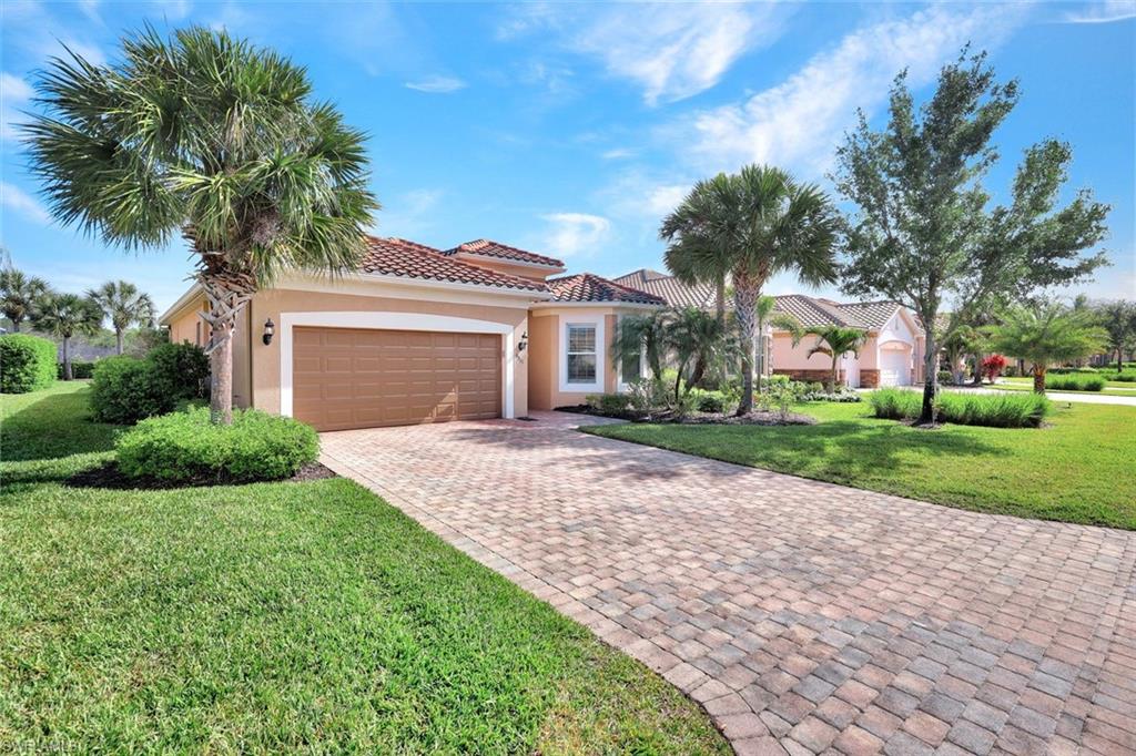 9311 Fieldstone Lane Naples, FL 34120 - Photo 38 of 48 a front view of house with yard and green space