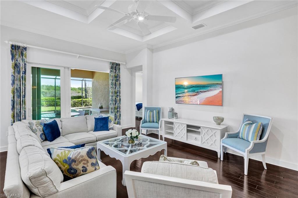9311 Fieldstone Lane Naples, FL 34120 - Photo 4 of 48 a living room with furniture and a flat screen tv