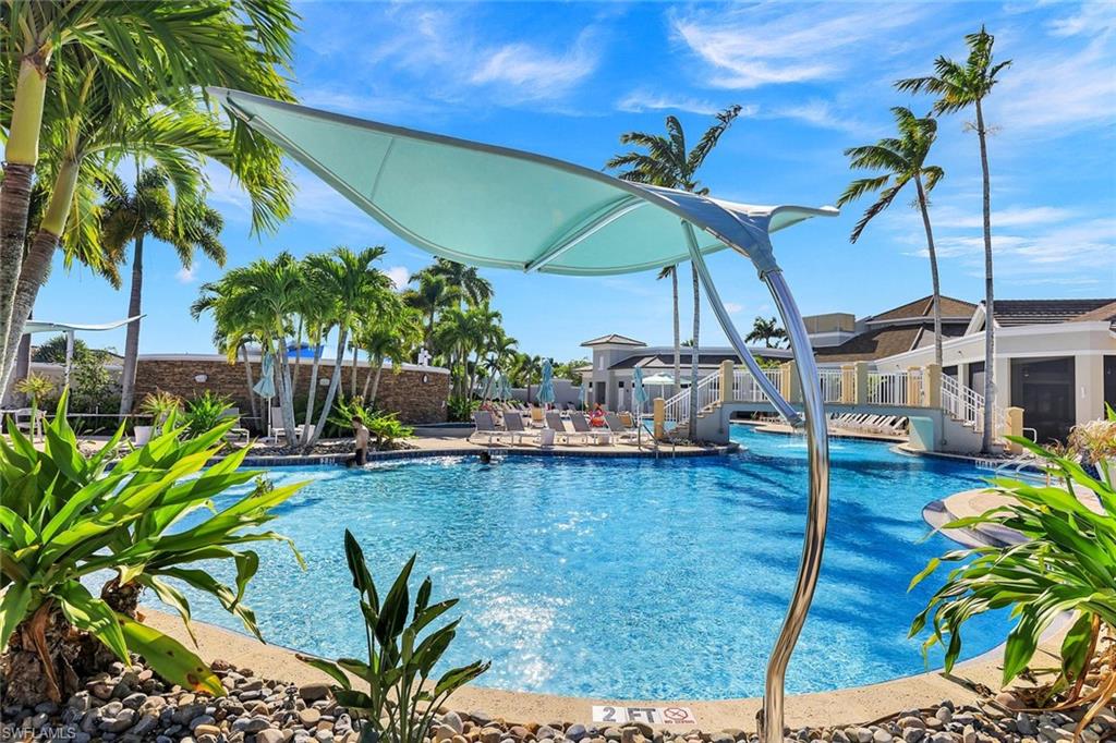 9311 Fieldstone Lane Naples, FL 34120 - Photo 43 of 48 a view of a swimming pool with a patio