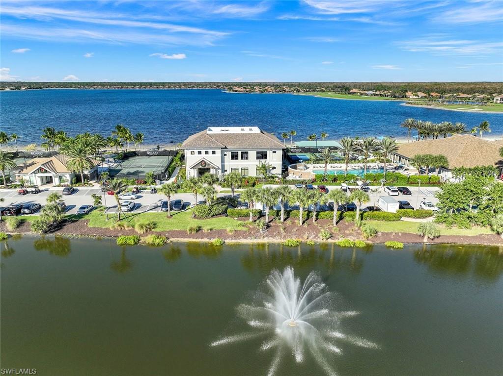 9311 Fieldstone Lane Naples, FL 34120 - Photo 48 of 48 a view of a lake with a nearby beach