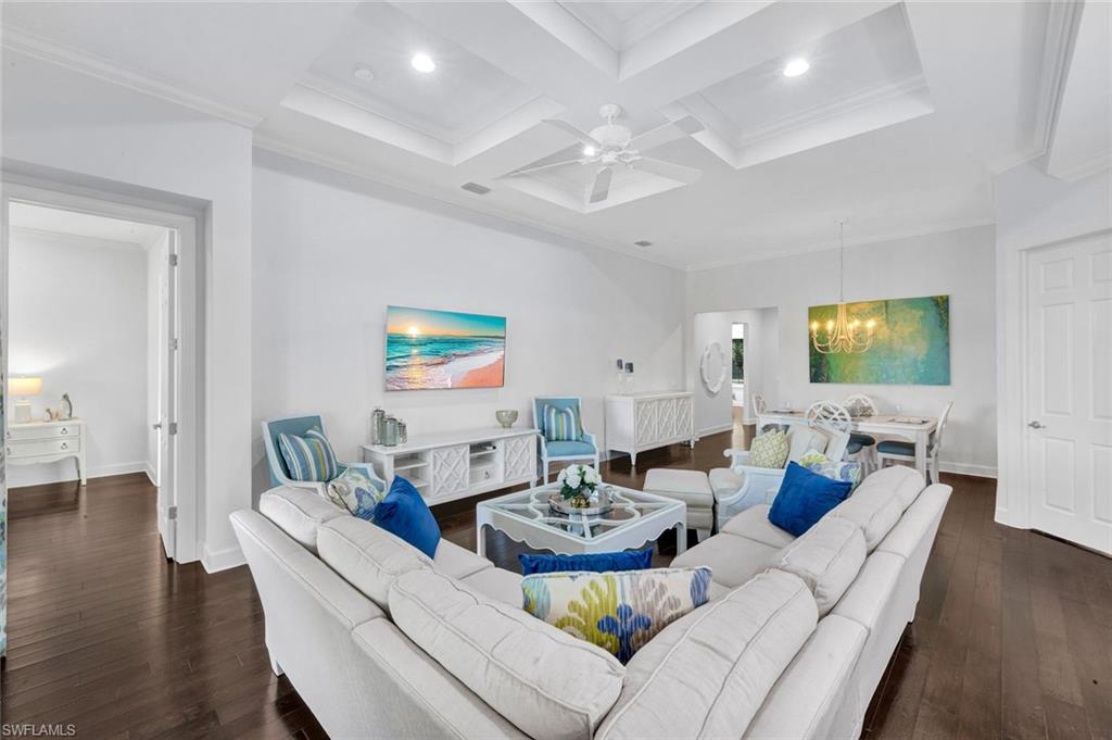 9311 Fieldstone Lane Naples, FL 34120 - Photo 5 of 48 a living room with furniture and a flat screen tv