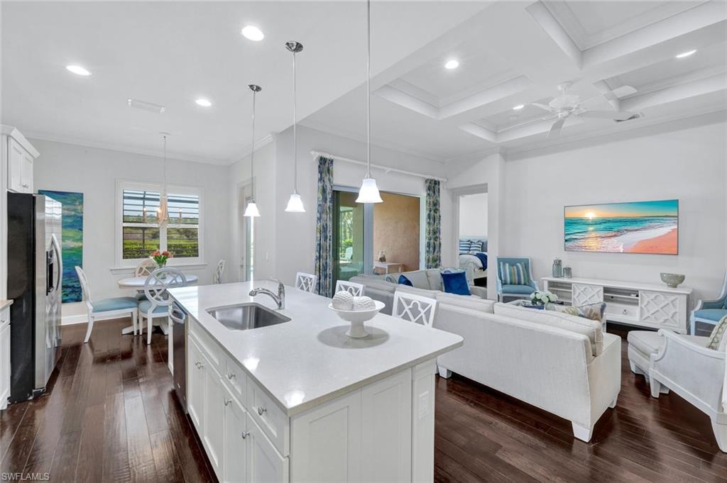 9311 Fieldstone Lane Naples, FL 34120 - Photo 7 of 48 a room with a large window table and chairs