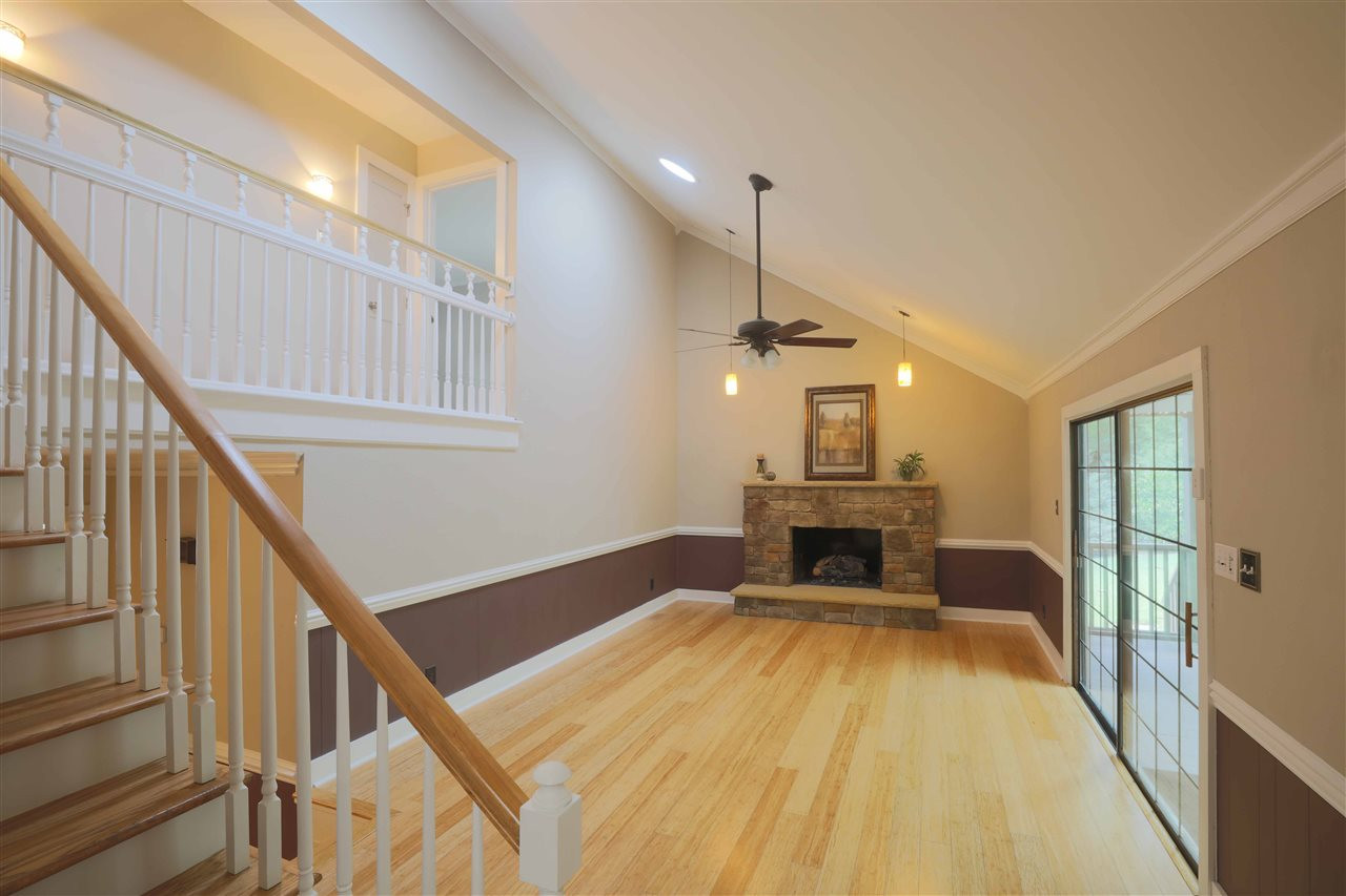 2017 Mallard Lane Raleigh, NC 27609 - Photo 3 of 25 Family room with 2 large Solatube skylights, vaulted ceiling, and large stone fireplace with premium radiant heat series vented gas logs. Family Room