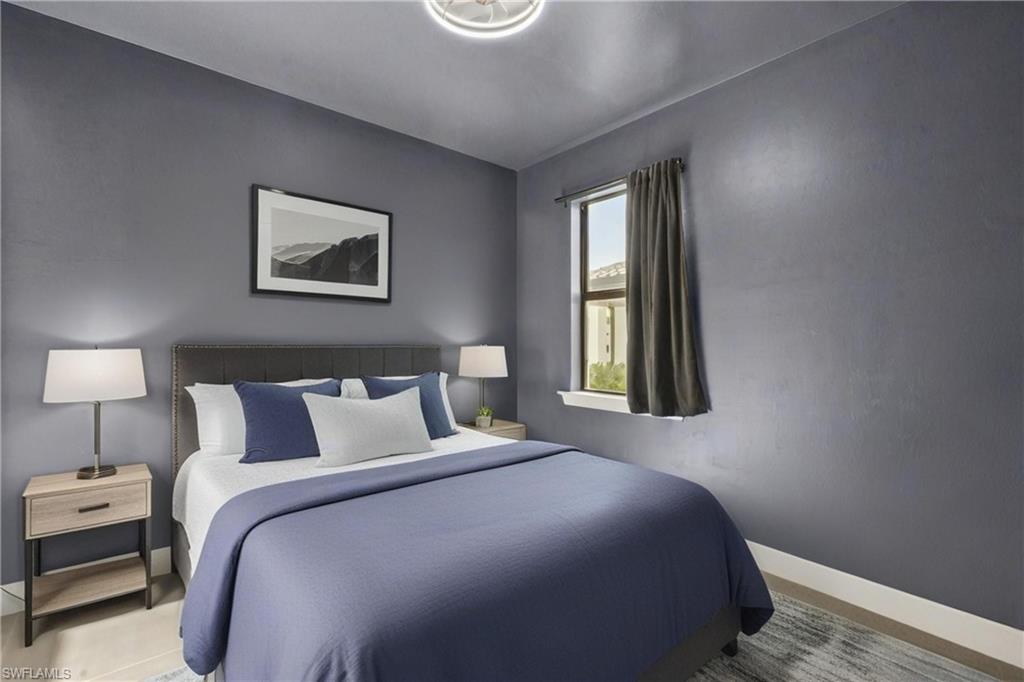 20250 Napa Loop Estero, FL 33928 - Photo 17 of 33 a bedroom with a bed and a window