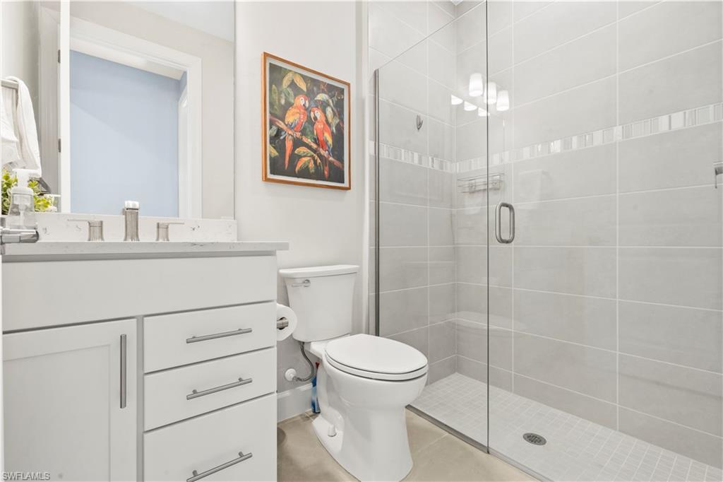 20250 Napa Loop Estero, FL 33928 - Photo 18 of 33 a bathroom with a sink a toilet and shower