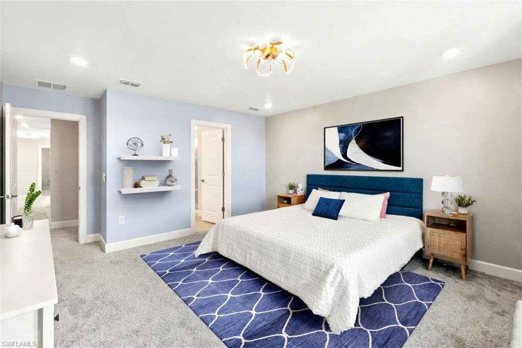 20250 Napa Loop Estero, FL 33928 - Photo 20 of 33 a bedroom with a bed and a view of kitchen