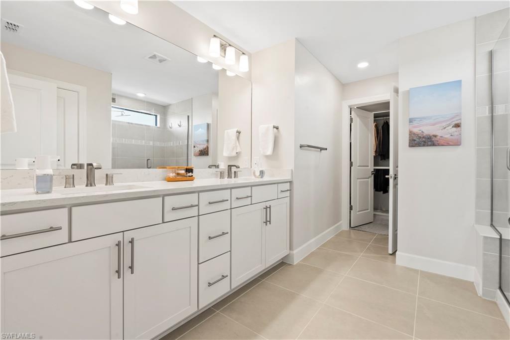 20250 Napa Loop Estero, FL 33928 - Photo 21 of 33 a spacious bathroom with a double vanity sink mirror and double