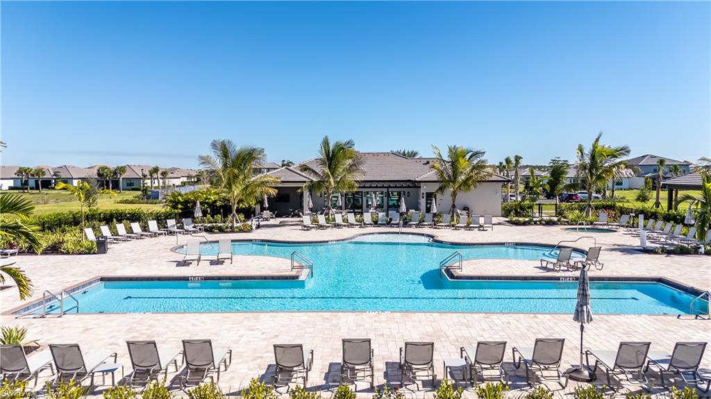 20250 Napa Loop Estero, FL 33928 - Photo 25 of 33 a view of a swimming pool with outdoor seating