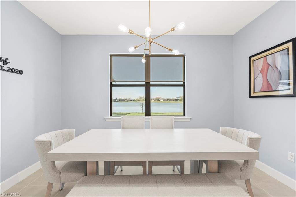 20250 Napa Loop Estero, FL 33928 - Photo 9 of 33 a room with a table chairs and a window
