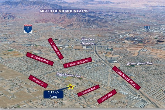Ithaca Avenue Henderson, NV 89015 - Photo 3 of 3 An aerial view showcases the property's location amidst the McCullough Mountains and major transportation routes.