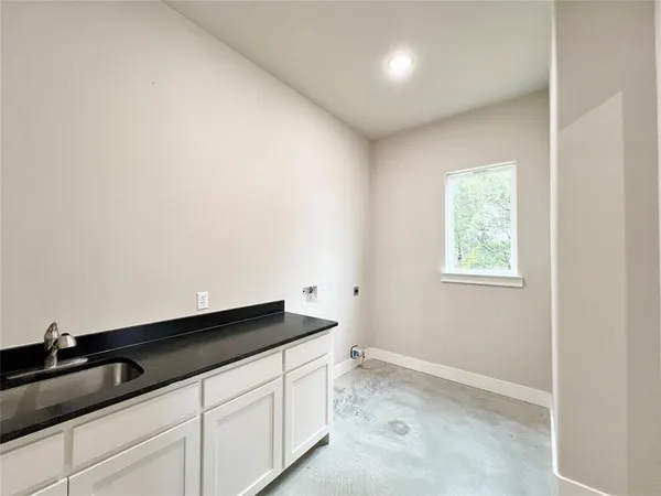 a kitchen with a sink and cabinets