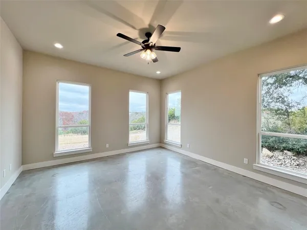 a view of an empty room with a window