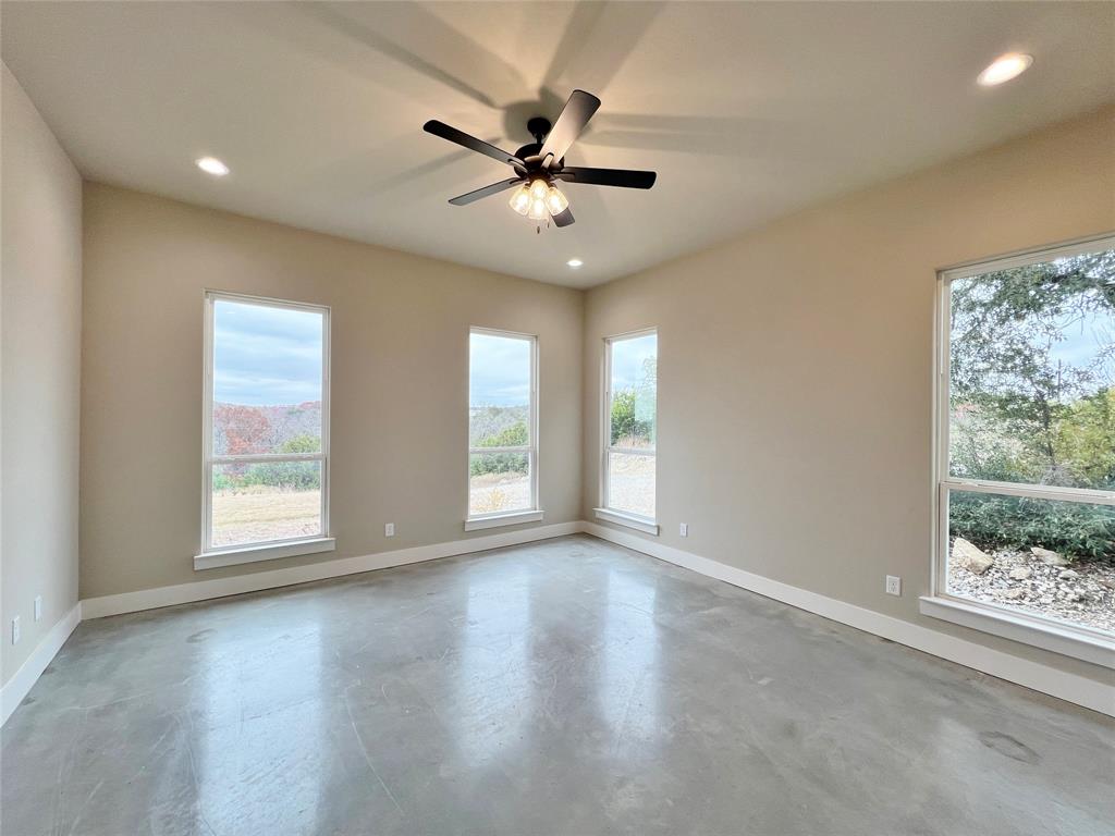 1141 Veal Station Road Springtown, TX 76082 - Photo 17 of 24 a view of an empty room with a window