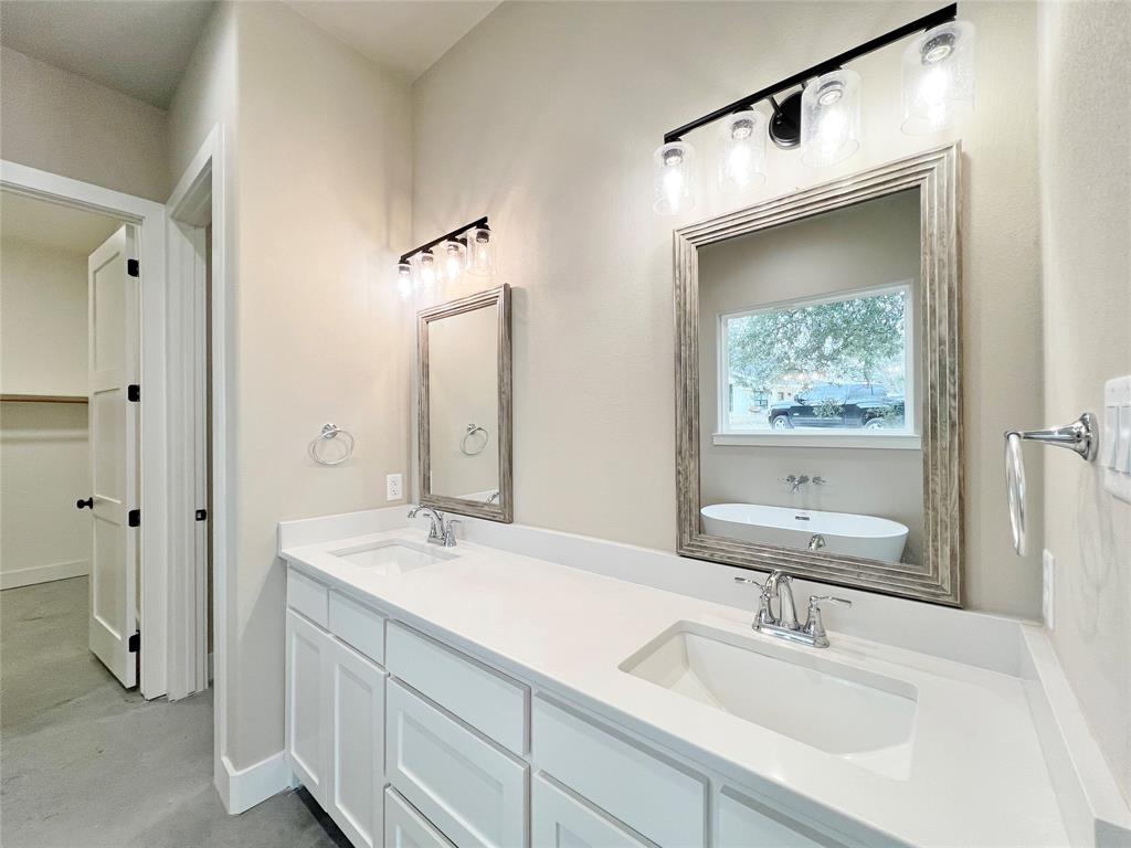 1141 Veal Station Road Springtown, TX 76082 - Photo 19 of 24 a bathroom with a sink and a mirror
