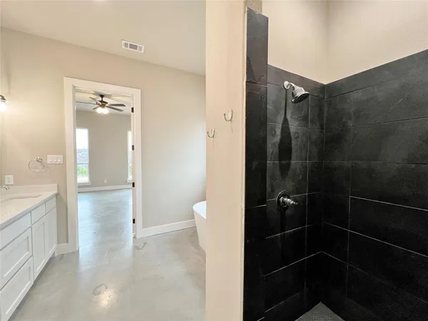 a bathroom with a shower and a toilet