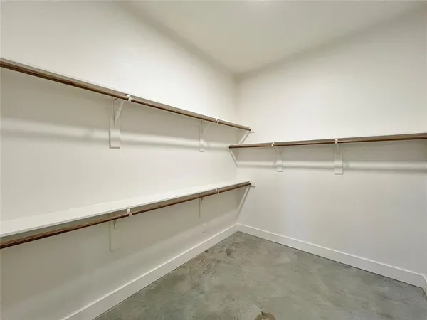 a view of an empty walk in closet