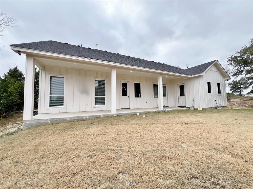 1141 Veal Station Road Springtown, TX 76082 - Photo 24 of 24 a view of a house with backyard and garden