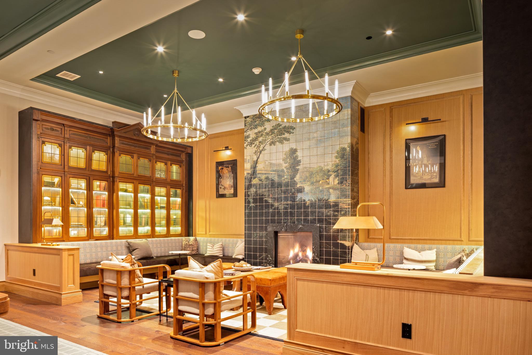 200 South Broad Street, Unit 906 Philadelphia, PA 19102 - Photo 24 of 49 a kitchen with a chandelier dining table and chairs