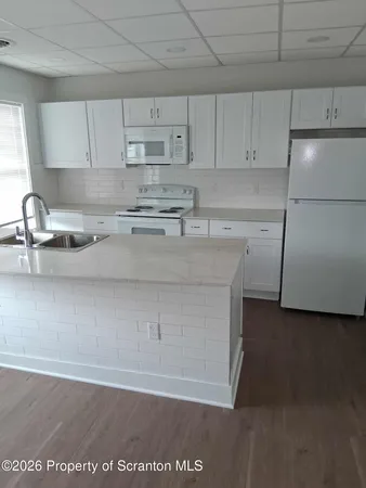 a kitchen with a sink and cabinets
