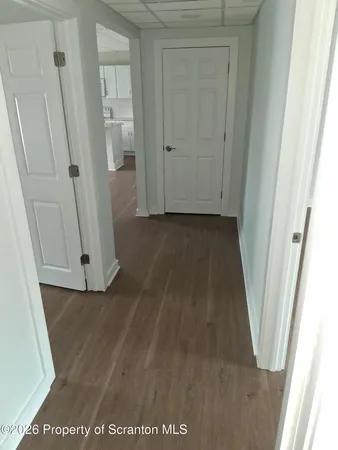 an entryway with wooden floor