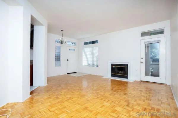 a view of empty room with a fireplace